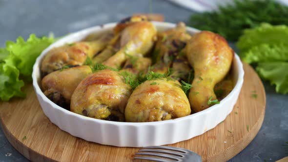 chef sprinkles the fried chicken drumsticks with chopped herbs8