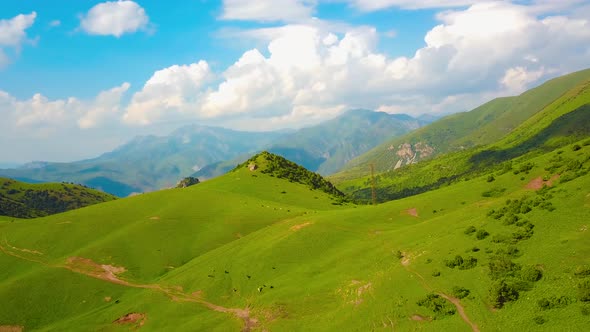 Mountains, Grassland, Sky and Clouds