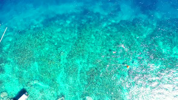 Aerial top view texture of relaxing lagoon beach lifestyle by blue sea and white sand background of 