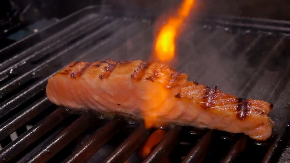 Salmon Fillet Steak Is Grilled on an Open Fire