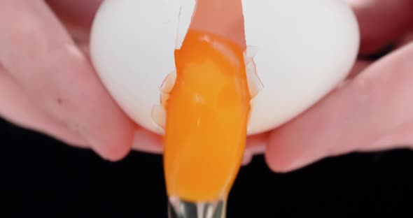 4K - Chef cracking an egg. Close-up