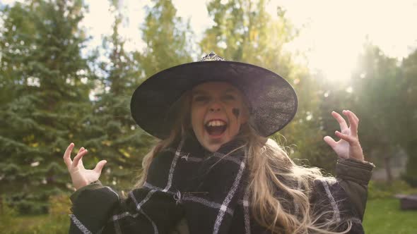 Little Girl in Witch Costume Roars at Camera and Frightens Viewer, Halloween