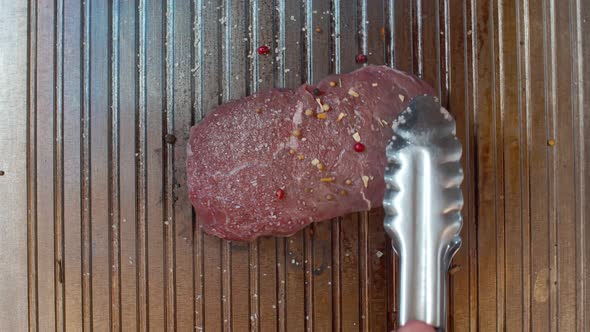 Beef Tenderloin Steak Fried in Spices and Salt Fried in a Grill Pan