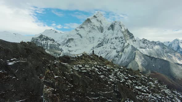 Hiker Man and Ama Dablam Mountain. Himalaya, Nepal. Aerial View