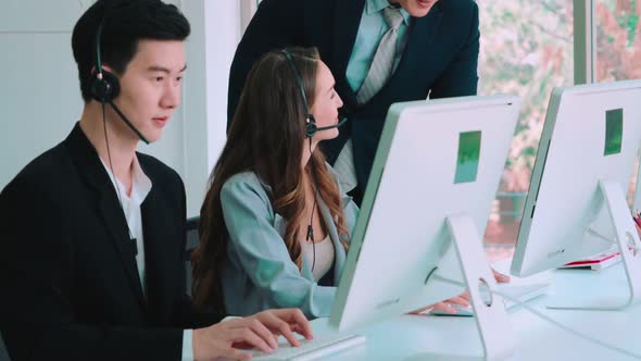 Business People Wearing Headset Working in Office