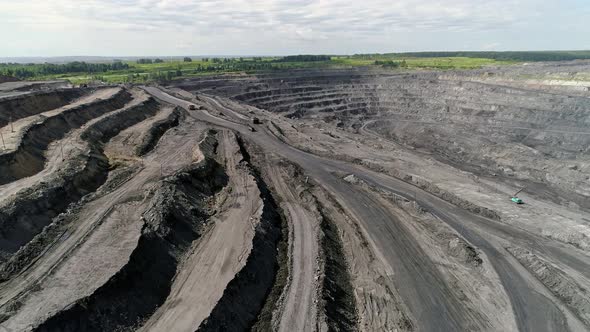 Panorama of large coal mine from the air, view of the ledges. Open Pit Anthracite Mining 