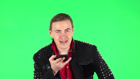 Guy Asks for Information on the Network Via Phone on Green Screen
