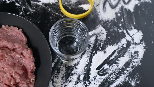 Accessories for Making Dough on a Dark Surface. 