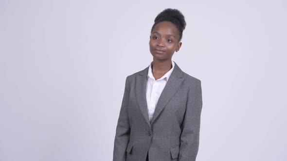 Young Happy African Businesswoman Smiling and Thinking