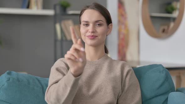 Portrait of Woman Shaking Head As No Sign