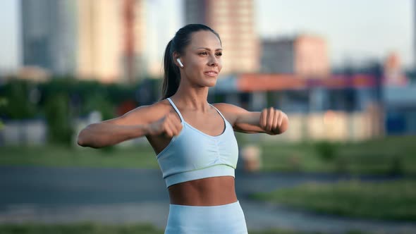 Tanned Female Training at Outdoor Sportsground Enjoying Healthy Lifestyle and Physical Activity