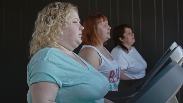 Chubby Women Walking on a Treadmill