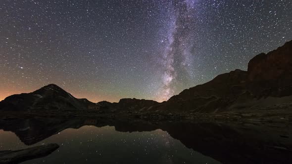 Time Lapse: the Milky way and stars apparent rotation over the majestic Italian French Alps