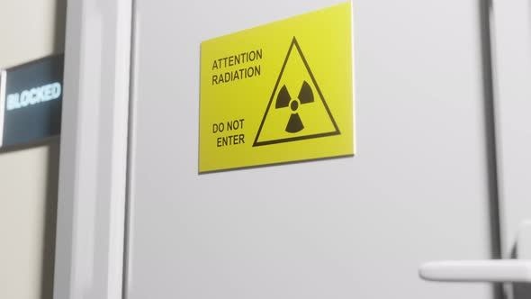 A locked door to a room with a radiation symbol.