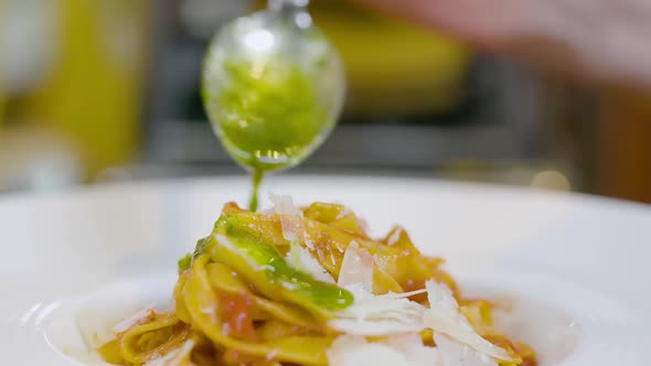 Cook Preparing Pasta Dish in Italian Restaurant