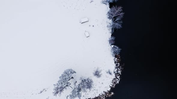 River and snowy field. Aerial view of nature, Poland.