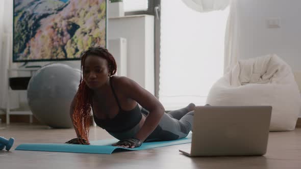 Trainer Woman with Black Skin Practicing Fitness Position During Yoga Morning Workout