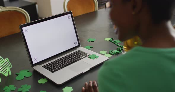 Happy african american woman making video call using laptop with copy space