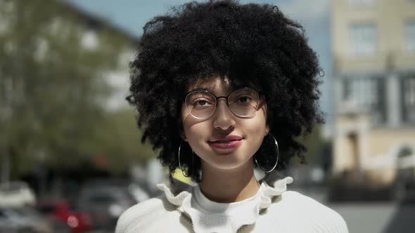 Adorable Girl With Afro Wearing Glasses.