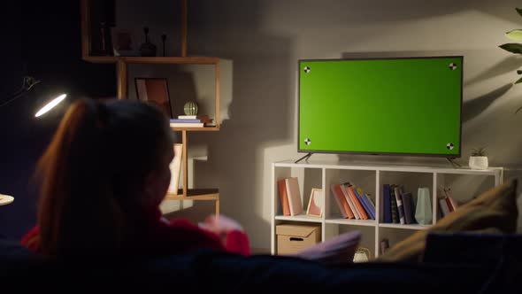 Woman Watching Television with Chroma Green Screen