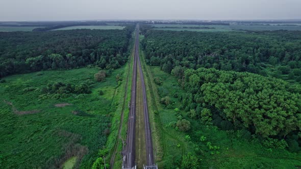 Railway Bridge in Countryside Passing Above Small River