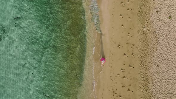 Traveler Woman Walking By Empty and Clean Sandy Beach Beautiful Hawaii Beach