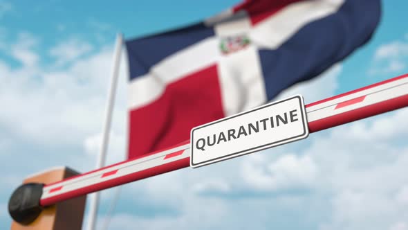 Open Boom Gate with QUARANTINE Sign at the Dominican Flag