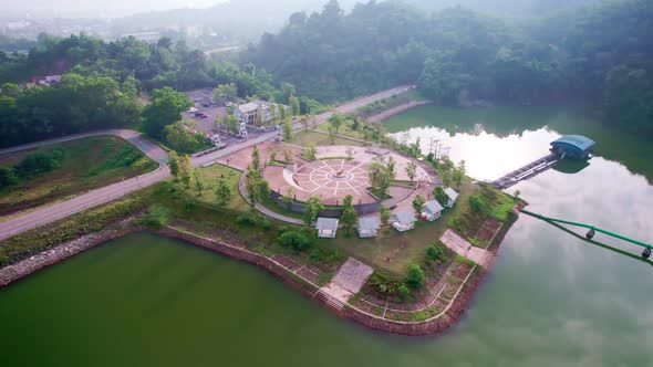 Aerial view of Dam lake mountains with forest green pattern in the morning. Sunny day summer weather