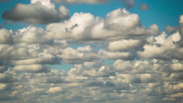 Cumulus Cirrus Clouds Move in the Blue Sky. Time Lapse.