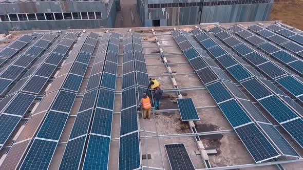 Installing solar panels on the foof of plant or factory. Additional source of electricity. 