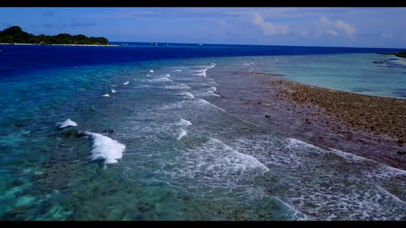 Aerial sky of marine resort beach time by shallow sea with white sandy background of a picnic near r