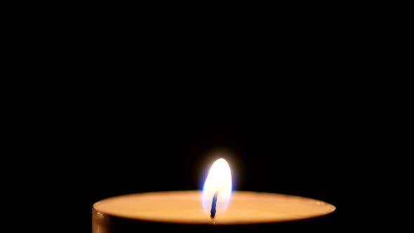 Candle Light on Black Background