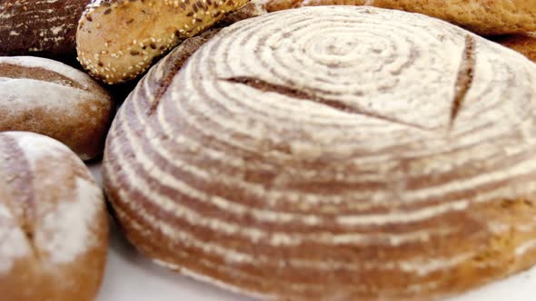 Various types of breads with wheat grains