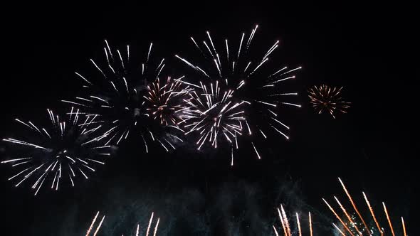Spectacular Fireworks Display with Confetti on Night Sky