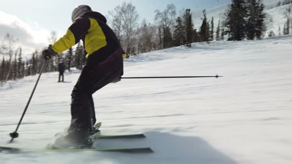 Skiing alone on perfectly groomed ski piste at ski resort