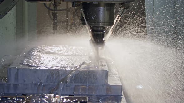 Slow motion of CNC mill manufacturing an advanced metal part