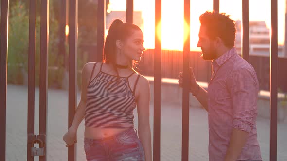 Man and Woman Talking Outdoor.