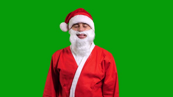 Santa Claus in Red Costume Standing and Smiling on Green Chroma Key Background