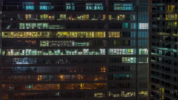 Windows of Office Buildings Night to Day Timelapse the Light From the Windows of Houses