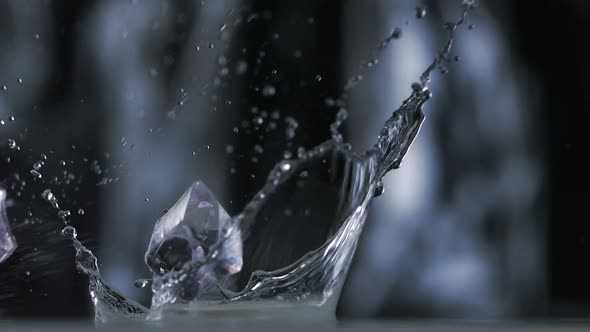 Colored cubes falling and bouncing on puddle, Slow Motion alt