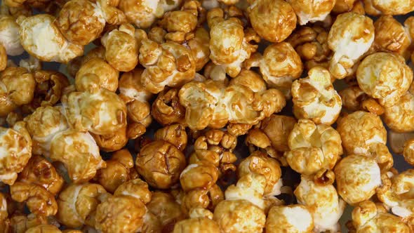 Coffee taste popcorns falls close up. Caramel popcorn. Healthy food for morning breakfast. Healthy