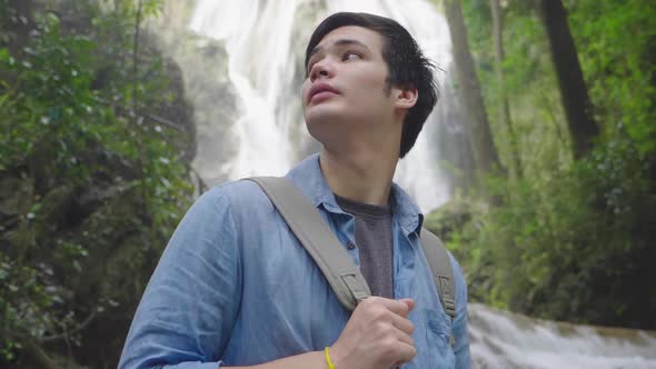 Young Man Hiking In Nature