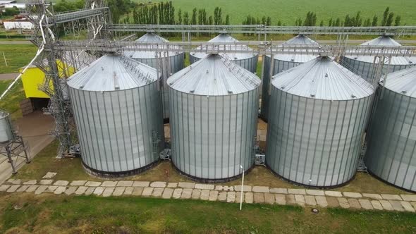 Grain silos elevator at the field. Aerial view