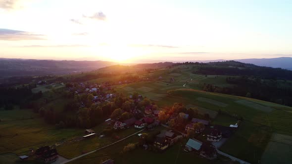 Sunrise at mountains, aerial view. Epic and colorful morning sunrise at mountain village.