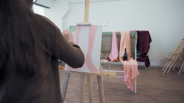 Young Girl with a Brush Draws a Picture