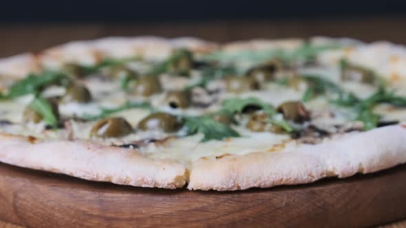 Appetizing Pizza on a Wooden Table in a Restaurant