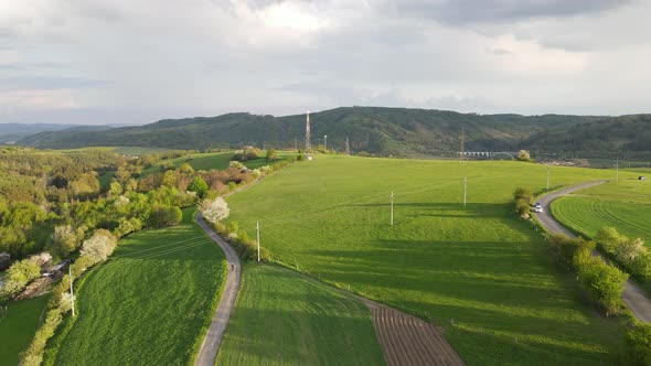 Beautiful 4k drone footage of meadow in Czechia. Fields and meadow with sunset