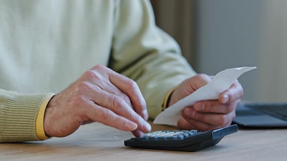 Closeup Hands Elderly Unrecognizable Man Calculating Payment Bills Sitting in Room Retired Considers