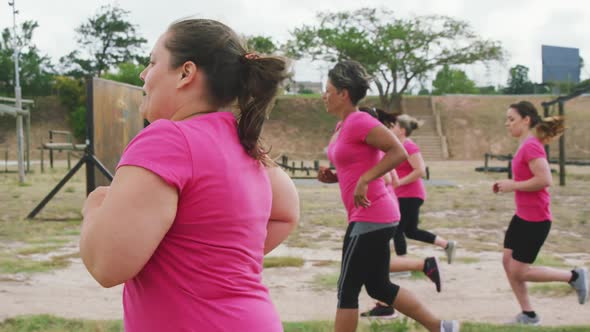 Female friends enjoying exercising at boot camp together