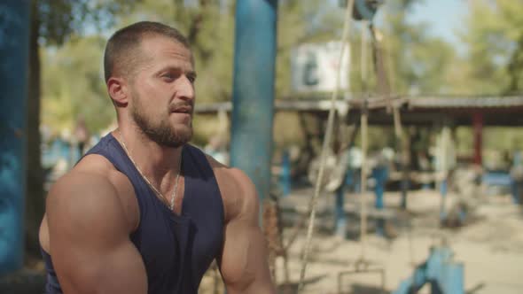 Portrait of Fit Man Exercising on Cable Crossover